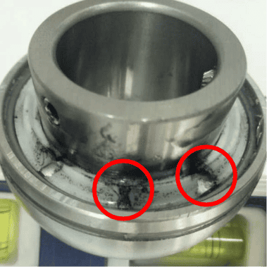 Competitor one's bearing insert, the back-side seal is removed to show the polymer fill. the fill is inconsistent.