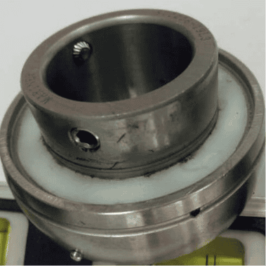 A Turner Lubrilife bearing insert, the back-side seal is removed to show the polymer fill. the fill is consistent and complete. All elements are protected.